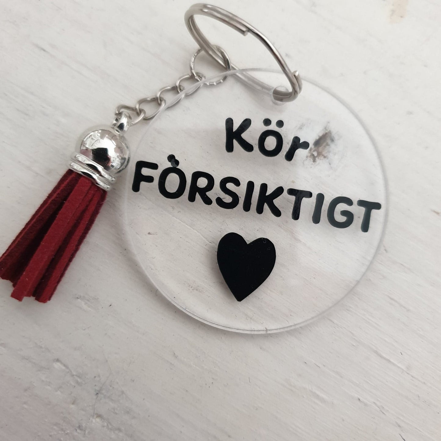 Nyckelring-Kör försiktigt