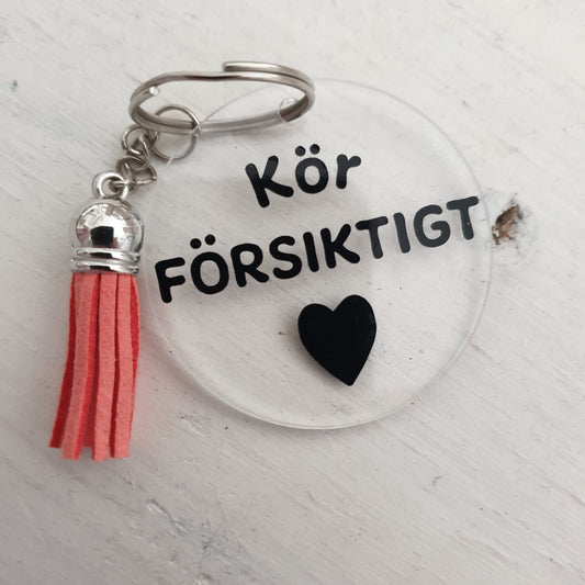 Nyckelring-Kör försiktigt