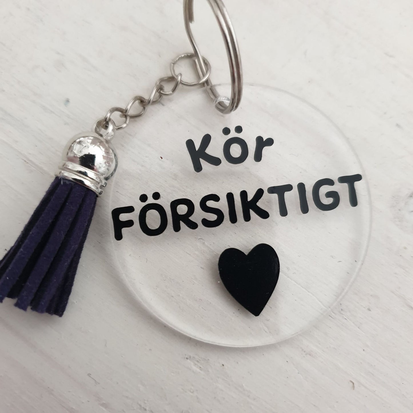 Nyckelring-Kör försiktigt