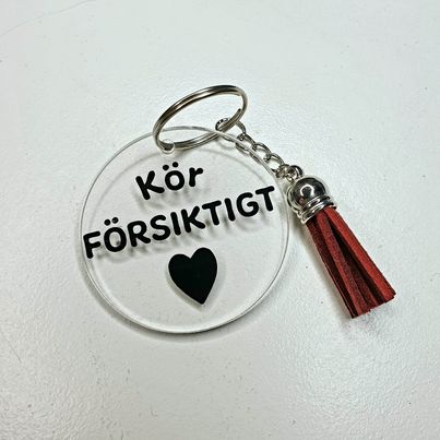 Nyckelring-Kör försiktigt