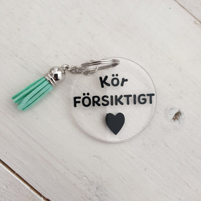 Nyckelring-Kör försiktigt
