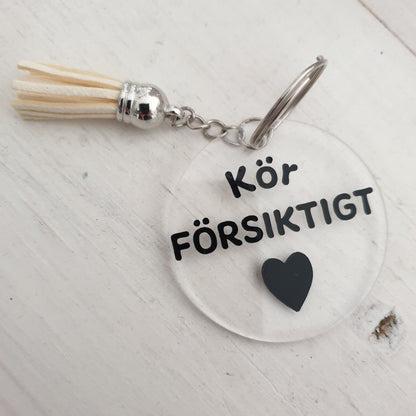 Nyckelring-Kör försiktigt