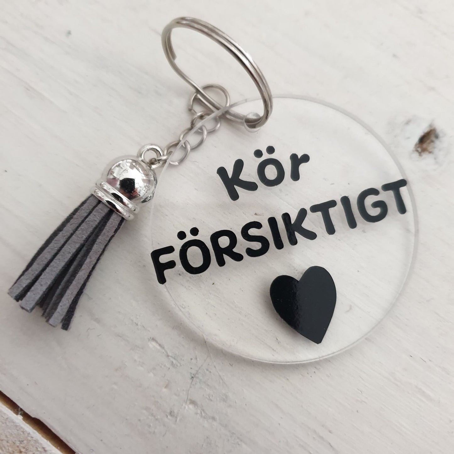 Nyckelring-Kör försiktigt