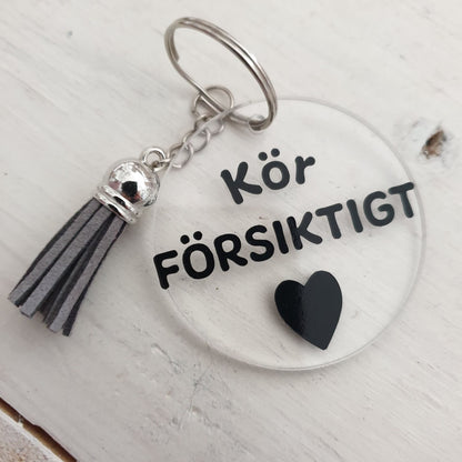 Nyckelring-Kör försiktigt