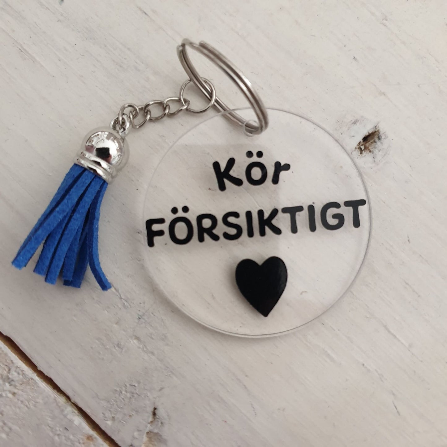 Nyckelring-Kör försiktigt